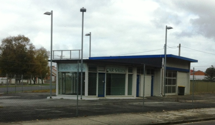 A once busy spot. Old Corner gas Station that looks like it was a car yard before it closed up