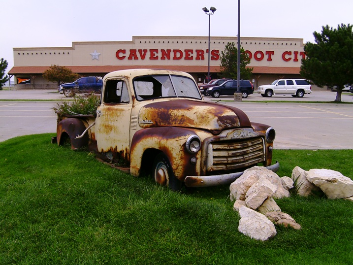 An old 50 GMC left as a roadside ornament outside a Boot Shop.